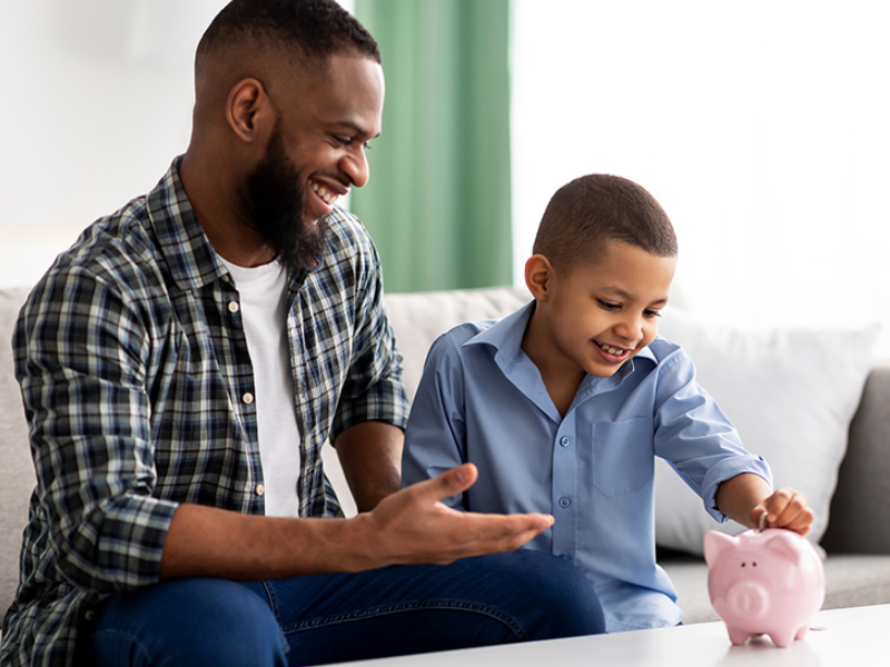 Father teaching son financial skills