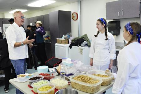 Culinary Challenge Student Mentor and Silver Diner Exec Chef Ype Von Hengst explains what to expect to students from Franklin Middle School