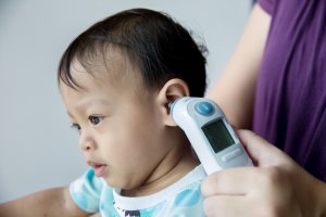 For potential colds or illnesses, it is good to have thermometers on hand, nasal aspirators, and a selection of baby medications for issues like pain, fever, and gas.