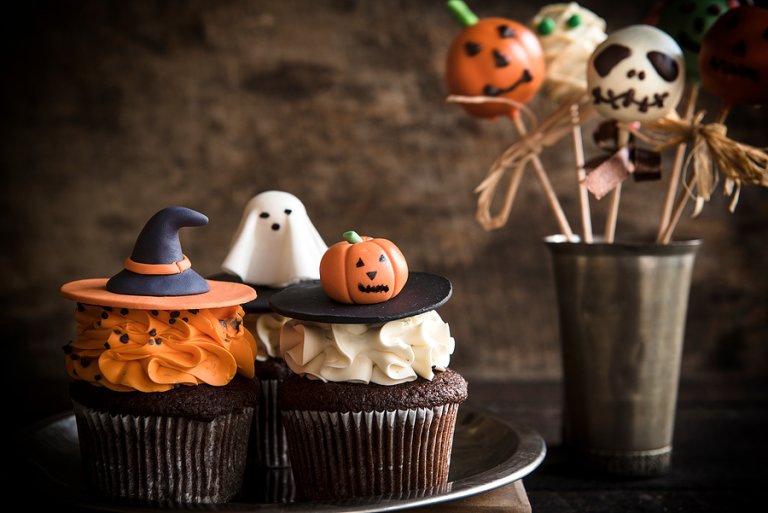 Spooky sweets: 7 spots for Halloween desserts in the DMV Halloween cupcakes with ghost and pumpkin decorations.