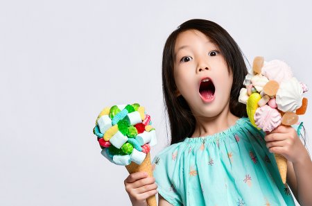 12 over-the-top ice cream spots in Washington, DC, that families love Girl enjoying one of the most over-the-top ice cream spots in DC