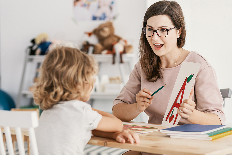 A specialist working one-on-one with a child, part of neurodivergent support in the DC area