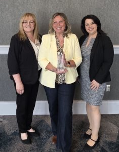 Sentara nursing leaders Chris McCormick (L) and Dawn Byrne (R) with Sentara ICU nurse Boryana Peeva (C) with the Employee of the Year Award. COPYRIGHT SENTARA HEALTH
