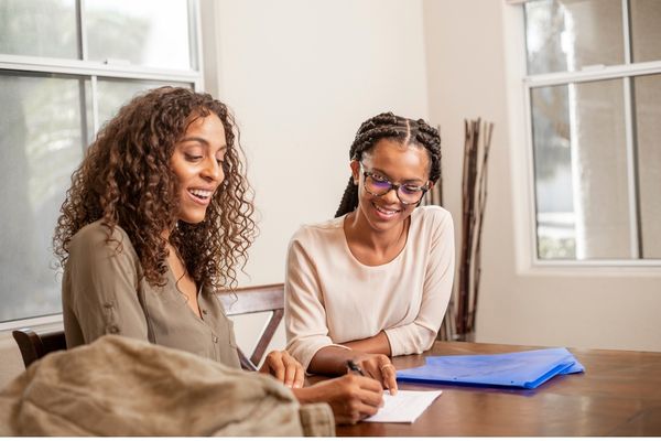 Students working with a tutor at a DMV tutoring and educational programs