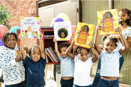 Little Free Library book-sharing box on a neighborhood sidewalk in the DMV