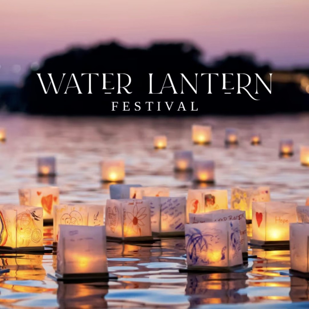 Hand-decorated paper lanterns glowing on the water at dusk during the Water Lantern Festival
