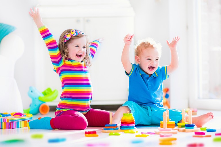 6 things every parent should check when choosing child care Young children playing with wooden toys at a child care center